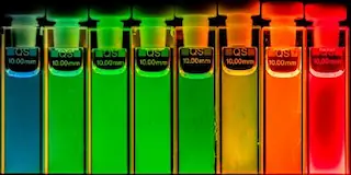 Quantum Dots in Glass Cuvettes Illuminated by UV Light